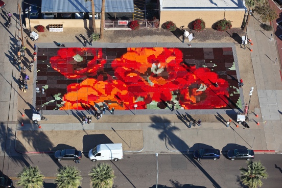 In an astounding testament to art's place in social practice, Ann Morton created "Ground Cover" on a vacant lot in downtown Phoenix. The two-day display consisted of thousands of knitted and quilted squares, assembled into blankets that are now headed to Phoenix's homeless population. Aerial photo courtesy of Ann Morton.