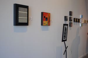 Plaques by Sarah Kriehn shared wall space with miniatures by Denise Yaghmourian at YAG Art Space on Grand Avenue.